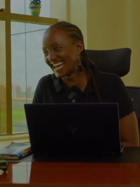 Muthoni Gathitu at her desk at Thinkk Travels